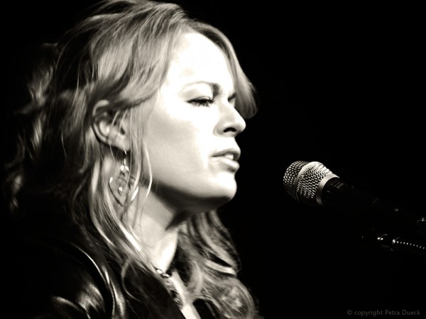singing at her CD release concert in April 2009